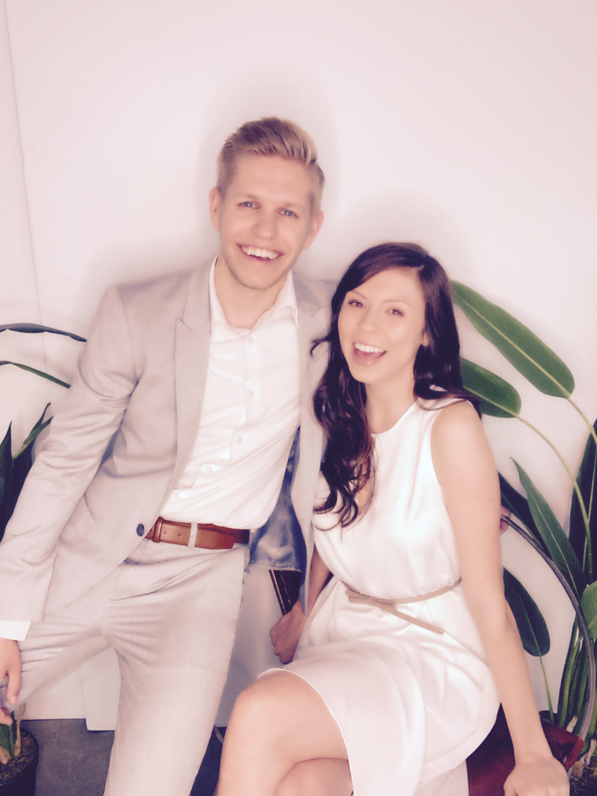 Happy couple posing in dress attire using salsa photo booth 2